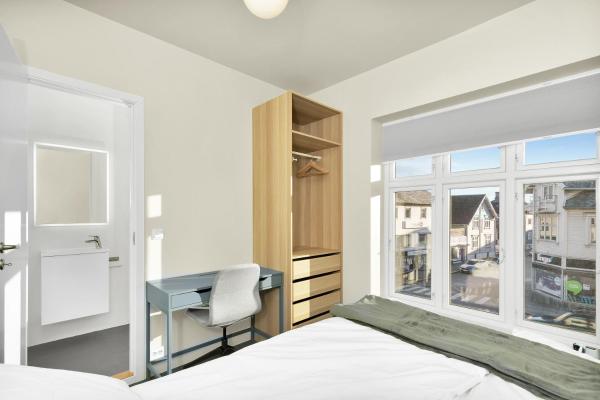 The photo shows the Central Guest House - Bedroom with en suite Bathroom located in the city of Stavanger.