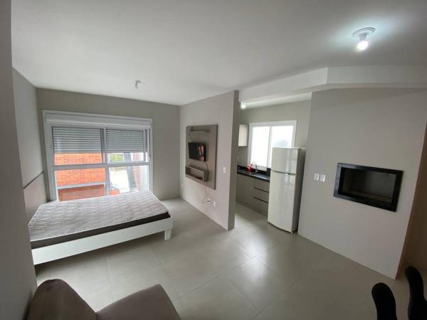 A la foto es mostra l'objecte Ótimo Loft 50m da areia churrasq 304 situat a la ciutat de Torres.