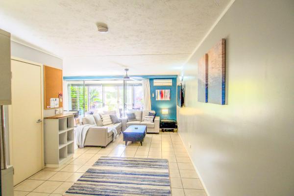 The photo shows the Black Sands located in the city of Rainbow Beach.