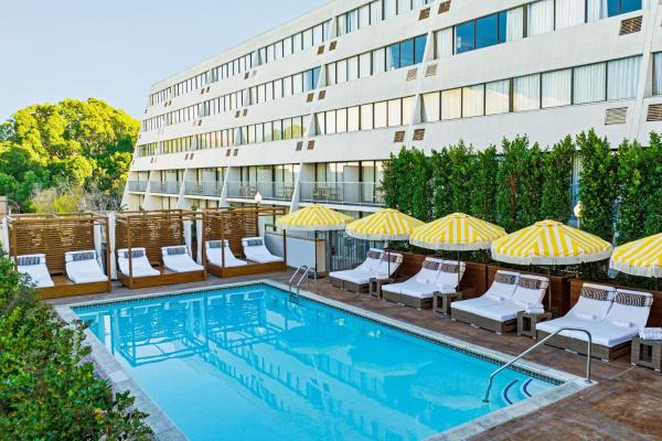 The photo shows the Hotel Dena, Pasadena Los Angeles, a Tribute Portfolio Hotel located in the city of Pasadena.