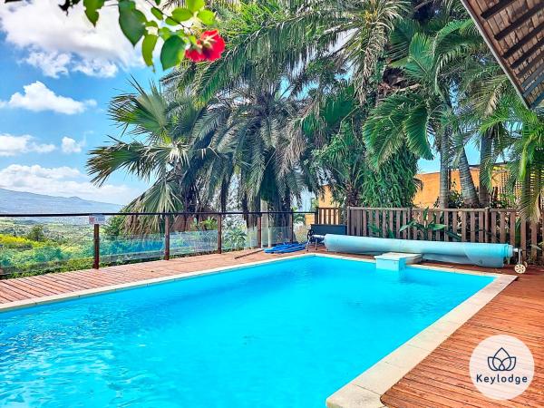 A la foto es mostra l'objecte Verger suspendu - avec piscine - 100m2 - Étang-Salé les Hauts situat a la ciutat de Gôl.