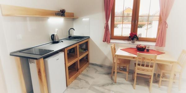 Na fotografii je vidět objekt Moravský Grunt Konírna nacházející se ve městě Těšetice.
