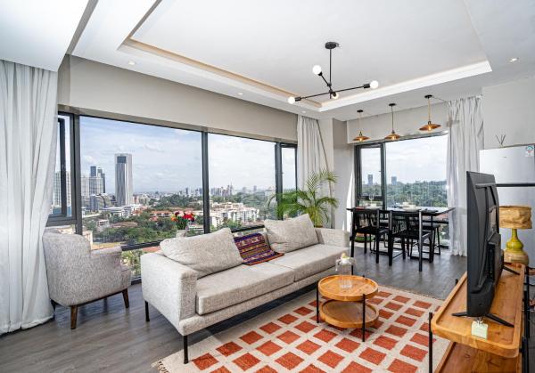 The photo shows the Escada Studio & 2-bedroom, Rooftop Lounge & Restaurant, Swimming Pool, Gym, Workspace, Wonderiss Properties Westlands Living located in the city of Westlands.