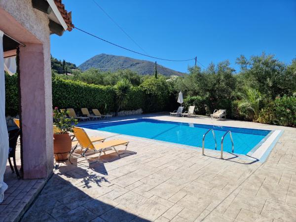 The photo shows the Villa Iliaktida - Private Villa with large Pool, Garden, Outdoor Kitchen & BBQ located in the city of Lithakia.