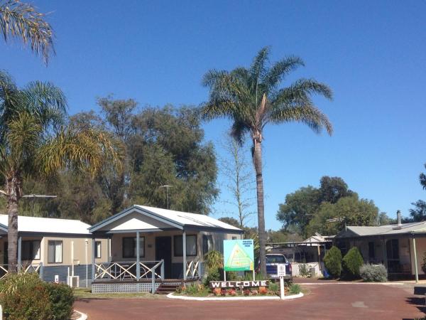 The photo shows the Pinjarra Caravan Park and Cabins located in the city of Dwellingup.