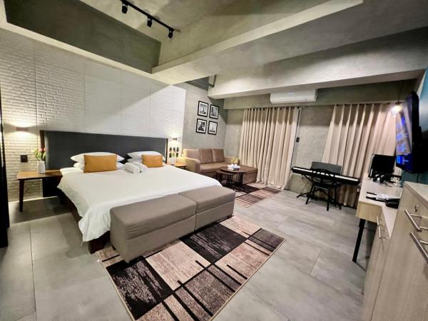 A la foto es mostra l'objecte Cozy Spacious Hotel Type Condo with Smart TV and WiFi situat a la ciutat de Manila.