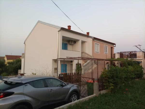The photo shows the Apartments with parking space Kraj, Pasman - 22566 located in the city of Tkon.