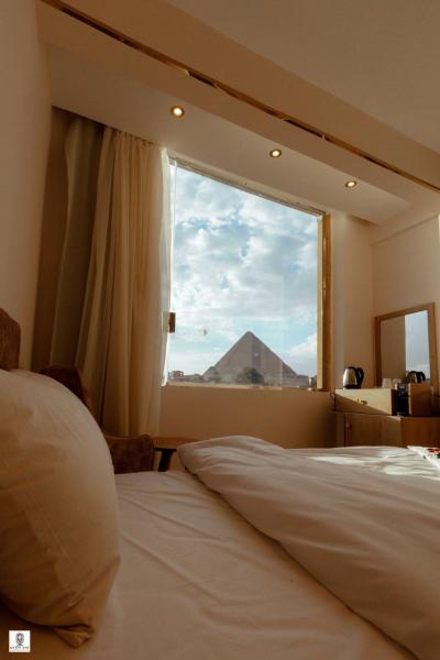 Nella foto è visibile l'oggetto Queen Ash Pyramids View Inn situato nella città di Il Cairo.