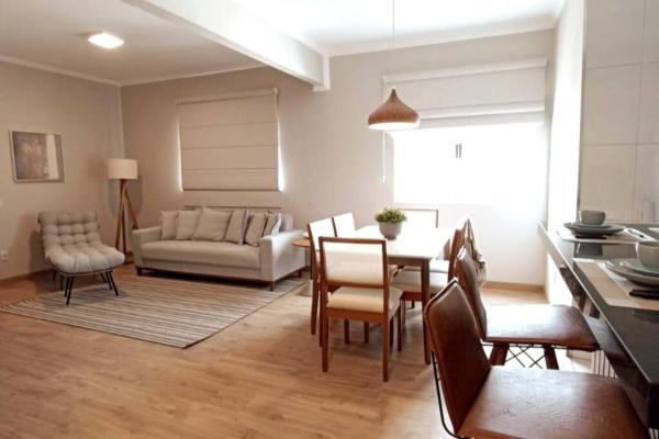 The photo shows the Super central e com muito charme located in the city of Poços de Caldas.