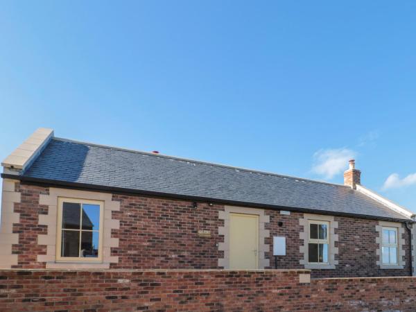 A la foto es mostra l'objecte Glebe Cottage situat a la ciutat de Alnwick.