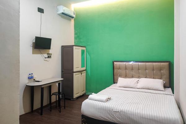 A la foto es mostra l'objecte RedDoorz Syariah near Universitas Jambi Telanaipura situat a la ciutat de Jambi.