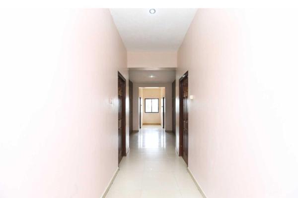 The photo shows the Hotel O Kamadhenu Lodge located in the city of Neyveli.