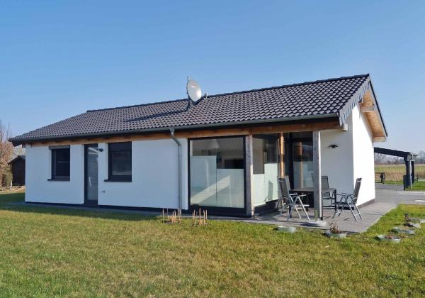A la foto es mostra l'objecte G4 Nordsee-Ferienhaus mit Sauna und Garten situat a la ciutat de Eckwarden.