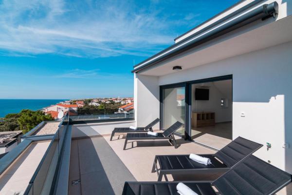 A la foto es mostra l'objecte Apartments by the sea Mandre, Pag - 22606 situat a la ciutat de Kolan.