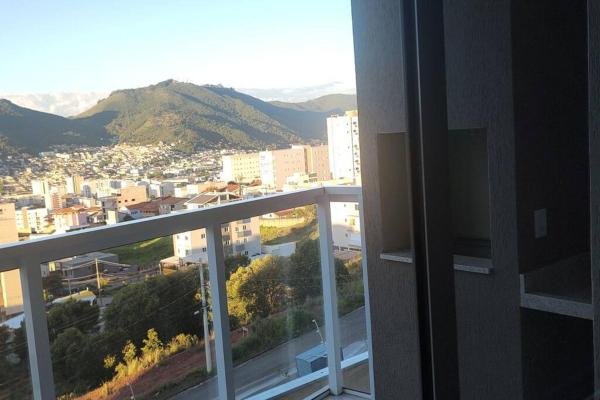 The photo shows the Apartamento Poços de Caldas located in the city of Poços de Caldas.