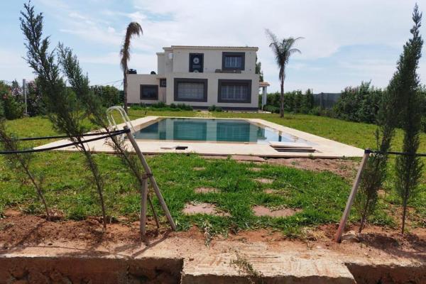 The photo shows the Maison avec piscine dans une ferme benslimane located in the city of Ben Slimane.