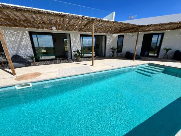 Na fotografii je vidět objekt Villa con piscina en Golf Isla Canela Links nacházející se ve městě Ayamonte.