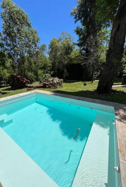 The photo shows the Cabaña Nordica located in the city of Garupá.