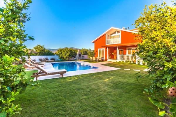 The photo shows the Villa Old Village located in the city of Dalyan.