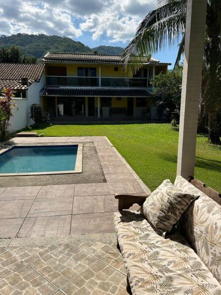 The photo shows the Casa com piscina em Aldeia Velha, Brasil located in the city of Córrego da Luz.