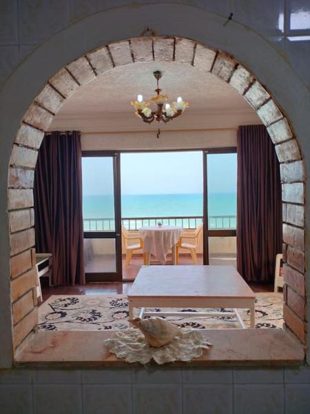 The photo shows the Sea view cozy apartment. located in the city of Ad Dayr.