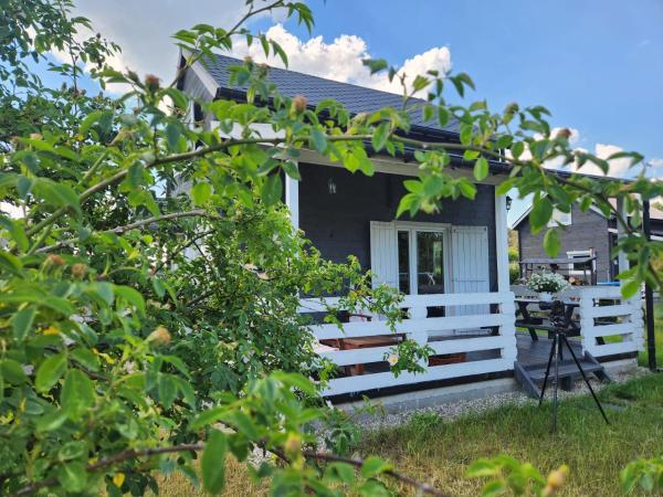 På bildet vises objektet Szary Domek 3 jacuzzi kominek jezioro klimatyzacja som ligger i byen Radziejów.