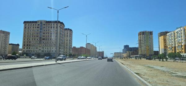 The photo shows the ЖК Инара located in the city of Aktau.