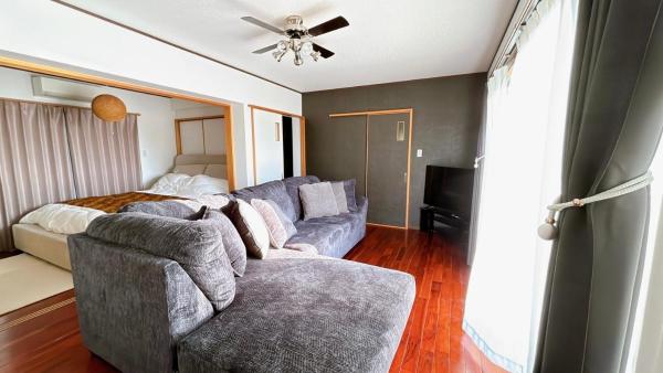 The photo shows the Ocean View Terrace BISE 1F located in the city of Motobu.