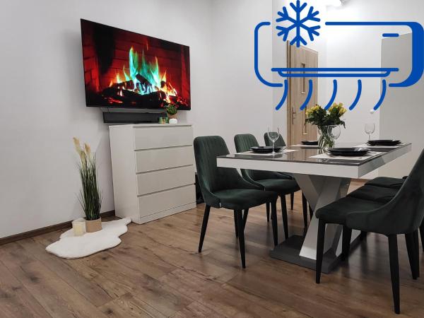 Na zdjęciu widoczny jest obiekt Przestronny Luksusowy Apartament, Klimatyzacja, Duży Parking, Zameldowanie 24h, 2 sypialnie, salon, kuchnia, pralnia, monitoring, 95mkw położony w mieście Sucymin.