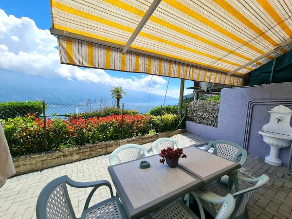 Auf dem Foto ist das Objekt Bellavista lago Apartment patio and view by Gardadomusmea in der Stadt Pieve zu sehen.
