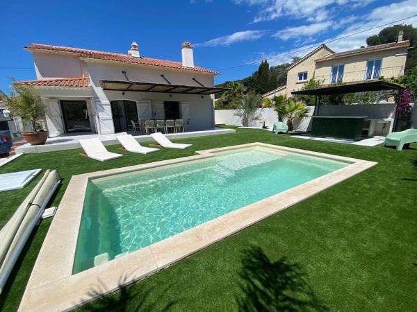 På billedet ses objektet Magnifique Villa avec piscine proche plage beliggende i byen Les Playes.