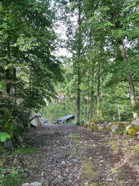 The photo shows the Calm and private country side property with own waterfront by large river located in the city of Siggamåla.