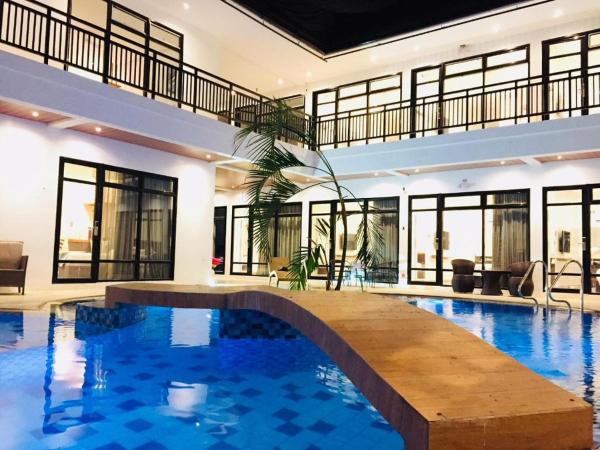 A la foto es mostra l'objecte White Breeze Palawan Boutique Hotel situat a la ciutat de Puerto Princesa.