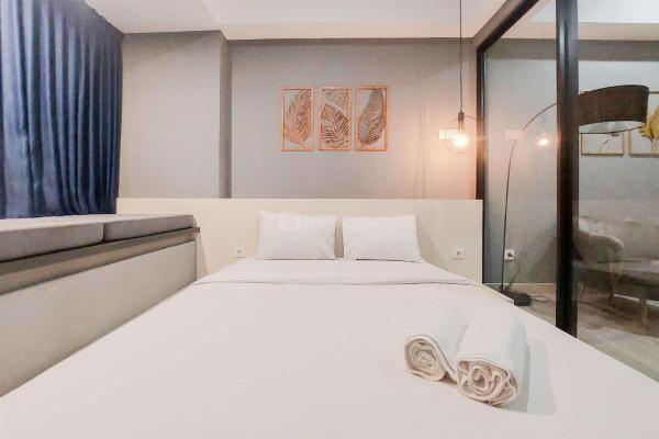 A la foto es mostra l'objecte Cozy Living 1BR Collins Boulevard Apartment By Travelio situat a la ciutat de Pakulonan.