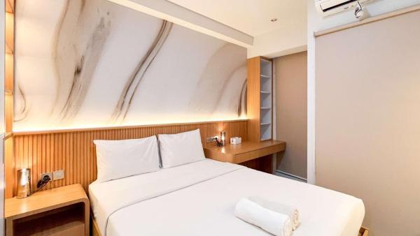 La photo montre l'objet Comfy Studio Apartment at Delft Ciputra Makassar By Travelio situé dans la ville de Sungguminasa.