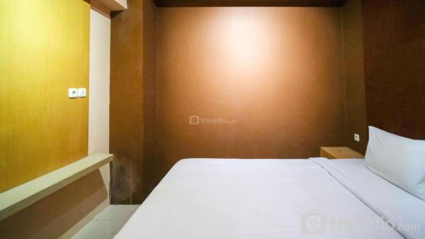 Op de foto is het object Comfy and Homey 2BR at Bale Hinggil Apartment By Travelio te zien, gelegen in de stad Medokansemampir.