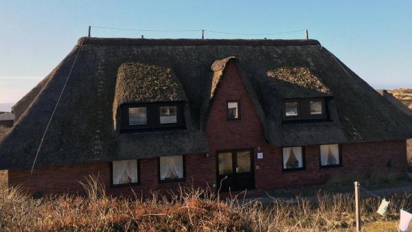 A la foto es mostra l'objecte Strandstraße 26 situat a la ciutat de Rantum.