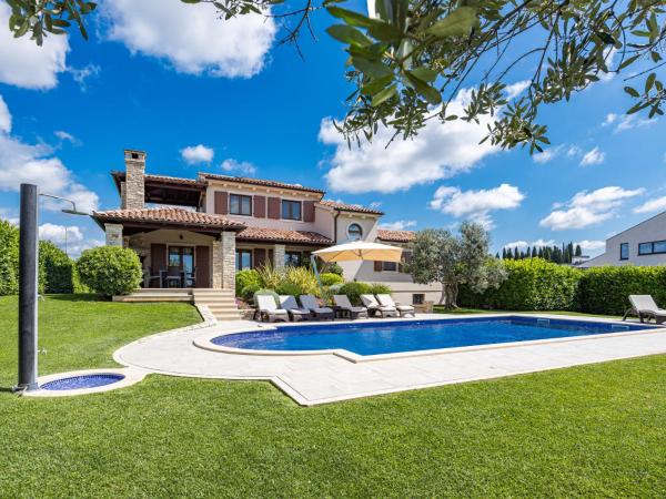 The photo shows the Villa De Flora by Interhome located in the city of Galižana.