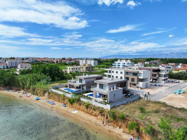 Na fotografii je vidět objekt Deluxe Apartments Privlaka on the Sand nacházející se ve městě Privlaka.