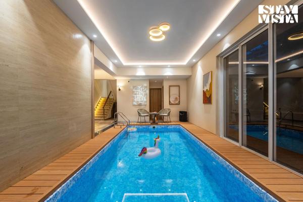 A la foto es mostra l'objecte Mocha House with Indoor Pool, BBQ & Bonfire at Lonavala by StayVista situat a la ciutat de Lonavala.