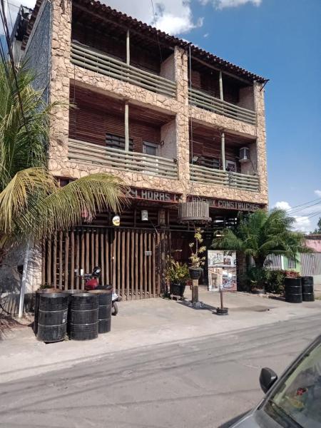 The photo shows the Casarão24horas quartos compartilhados located in the city of Cuiabá.