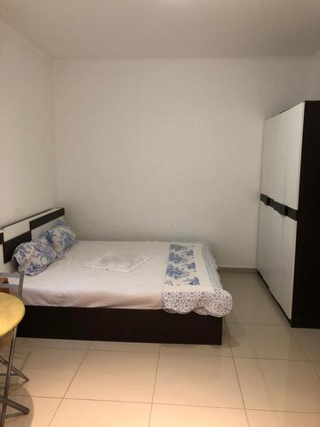 The photo shows the Talatona Cozy Inn located in the city of Santo Amaro.
