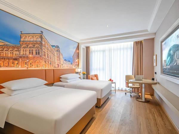 A la foto es mostra l'objecte Vienna Hotel Jiangjin Wanda Plaza Shengquansi Subway Station situat a la ciutat de Jiangjin.