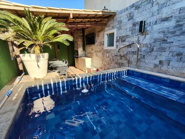 Na foto é possível ver o objeto Casa Bougainville - Casa de 3 quartos, frente pro mar, piscina privativa aquecida, Wifi 400 Mb, Playstation 5 localizado na cidade de Costa.