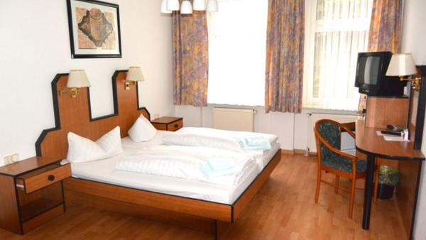 Na fotografii je vidět objekt Apart-Hotel-Pension nacházející se ve městě Taucha.