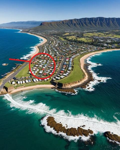 A la foto es mostra l'objecte Palm Rest - 2BR Beachside Escape On Towradgi Beach situat a la ciutat de Towradgi.