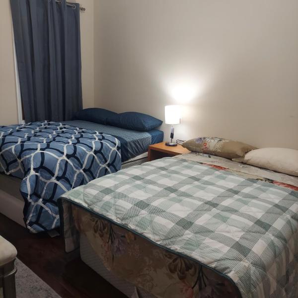 The photo shows the Double queen room 6 minutes walk to Penn station NYC EWR located in the city of Croxton.
