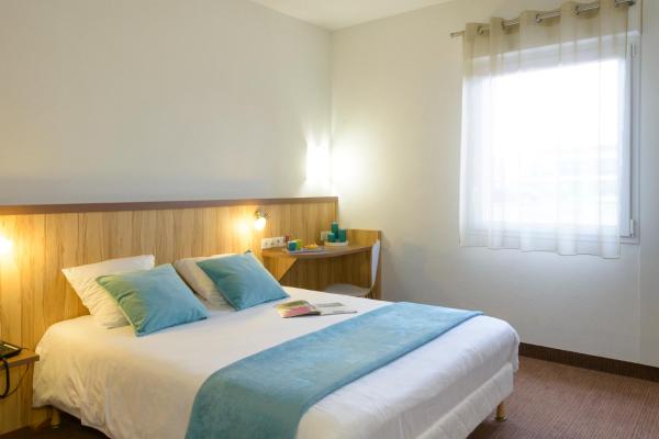 Na zdjęciu widoczny jest obiekt Brit Hotel Reims Croix Blandin położony w mieście Reims.