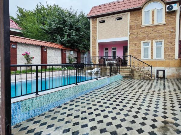 The photo shows the Gabala Waterfall Villa located in the city of Nohurqışlaq.