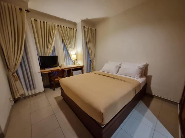 A la foto es mostra l'objecte Rumah Pak Hani, Apartement 2 Kamar Tidur situat a la ciutat de Kejayan.